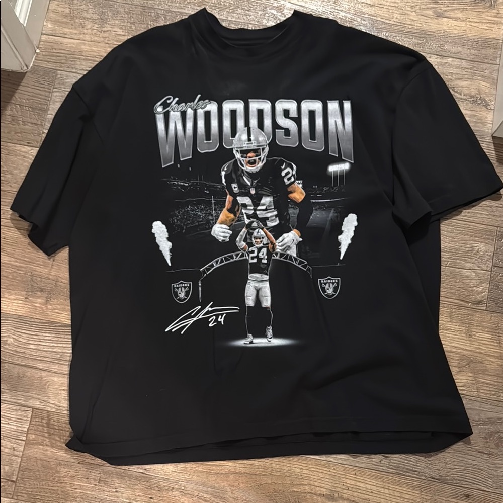 Black Raiders tee with  Charles Woodson